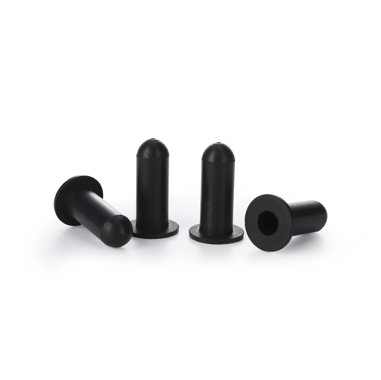 Silicone caps with flanges for high-temperature masking in powder coating applications.